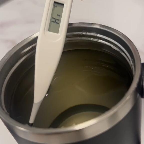 A thermometer reading above 50°C after 8 hours in the thermos cup.