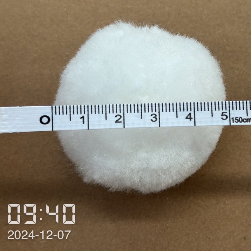 Measuring the Diameter of Polyester Fiber Balls Measuring the diameter of polyester fiber balls to ensure quality standards.