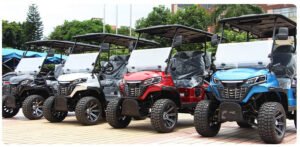 4 different color electric golf carts on display, powered by lithium batteries