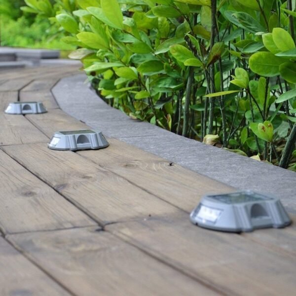 Solar-powered LED pathway markers improving park safety.