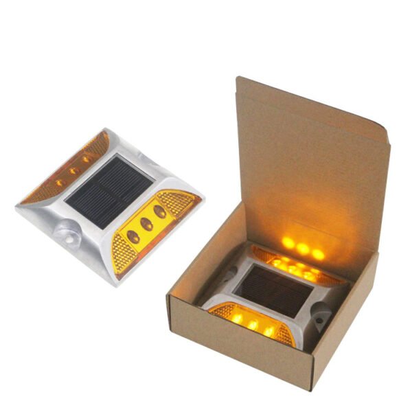 Yellow solar road marker in retail packaging