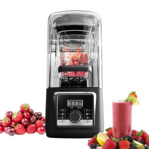 Black silent juicer blender filled with red fruits, next to a glass of red juice and raspberries