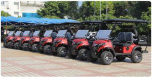 Row of red 4-seater lithium golf carts displayed together