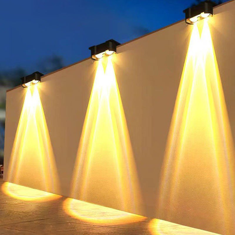 White Solar Fence Light - Illuminating Lime Wall White solar fence light installed on a lime wall for a bright outdoor effect.