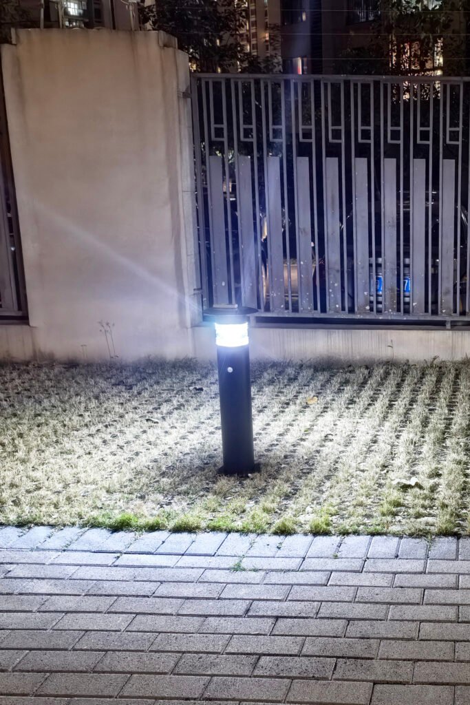 Nighttime Brightness Comparison of yard solar lights Yard solar lights brightening a grass lawn