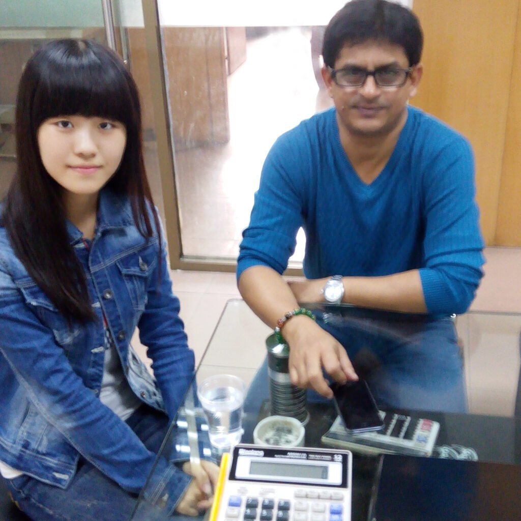 Logistics and Procurement with Bangladesh Client Tiny with Bangladesh client in 2016 at the office, a proud moment as a reliable China sourcing partner.