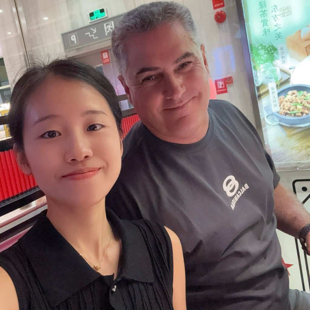 Creating Genuine Connections with French Client Over BBQ Tiny with her French client enjoying a BBQ, symbolizing trust and international friendship.