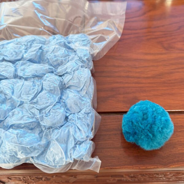 Comparison of vacuum-packed blue polyester filter balls and an uncompressed ball