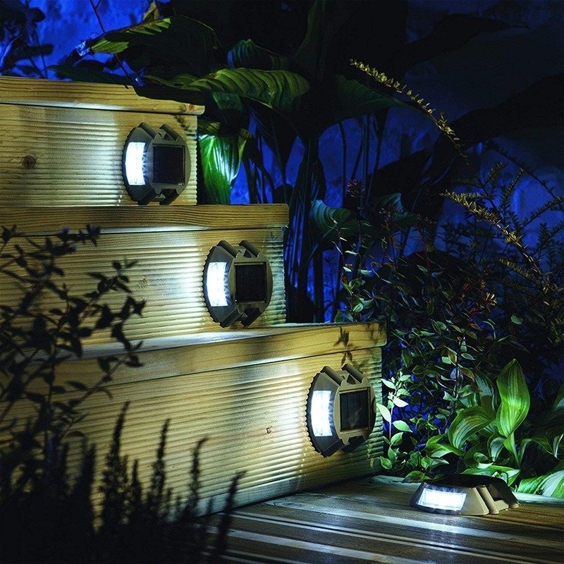 Solar road studs lighting steps of an outdoor park staircase at night