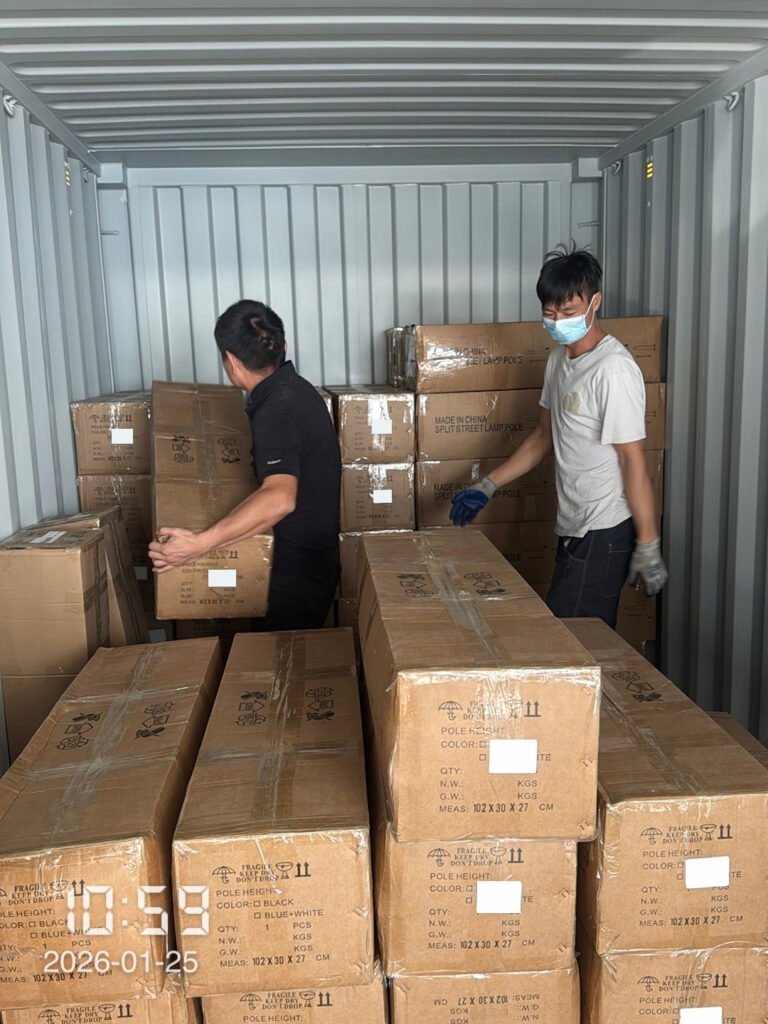 Workers organizing cargo inside the container