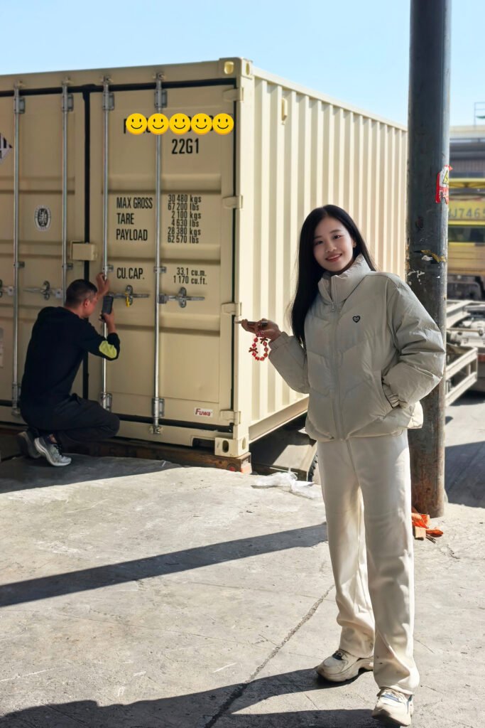 Tiny Lee, founder of JXNUO, at a container loading site in China during shipment follow-up