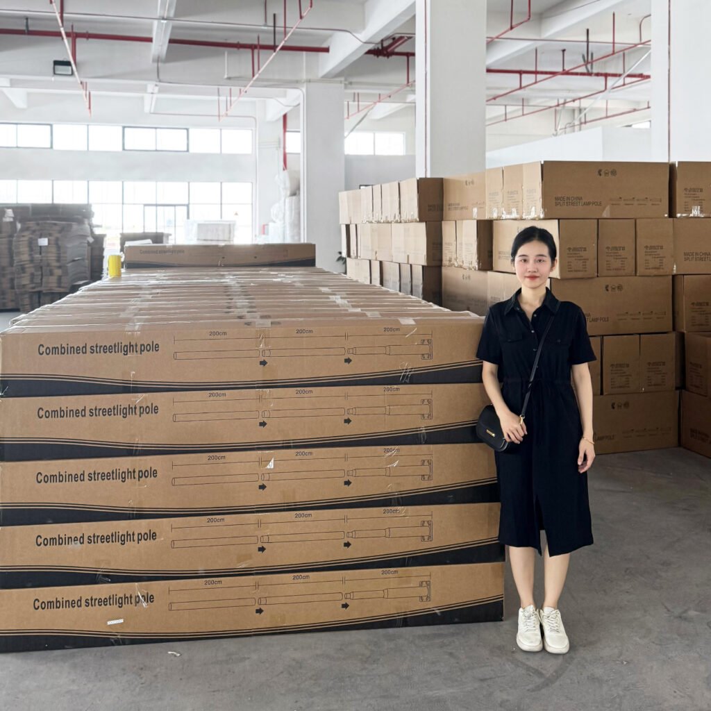 Supplier Factory Visit for Street Light Pole Sourcing Factory visit in China reviewing packaged street light poles during supplier sourcing